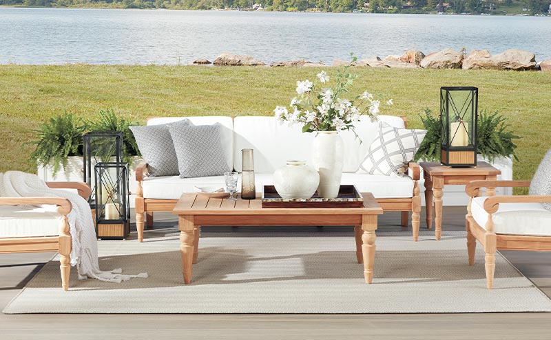 outdoor room with sofa and two chairs