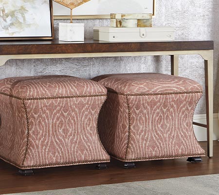 ottomans under console table